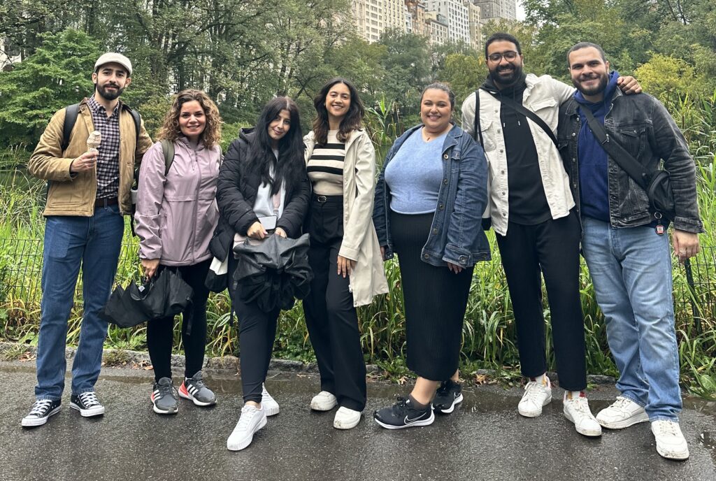 Group of PFP Fellows posing in front of green space