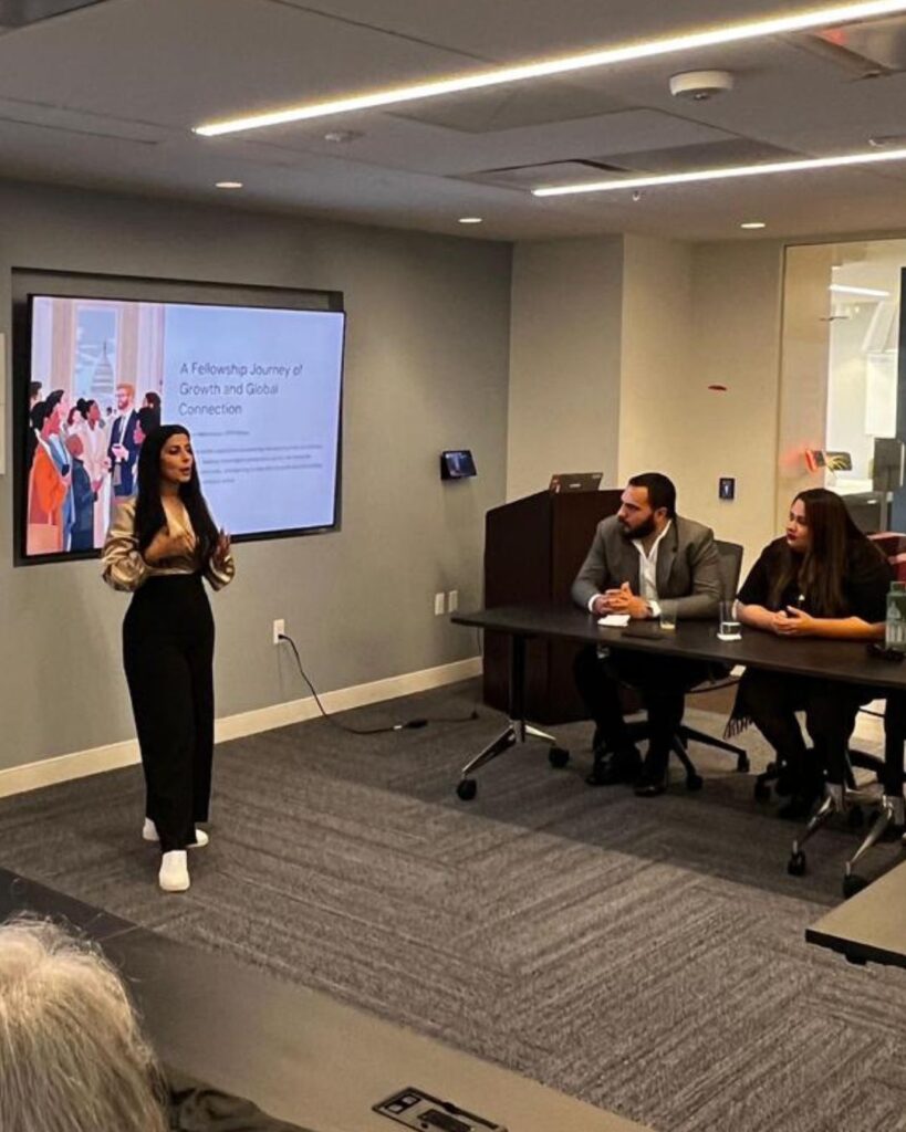 Jennifer presenting the highlights of her fellowship experience to other DC Fellows and hosts.